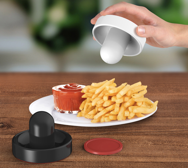 Illustration for article titled Paddle Salt and Pepper Shakers Bring Air Hockey To the Dinner Table